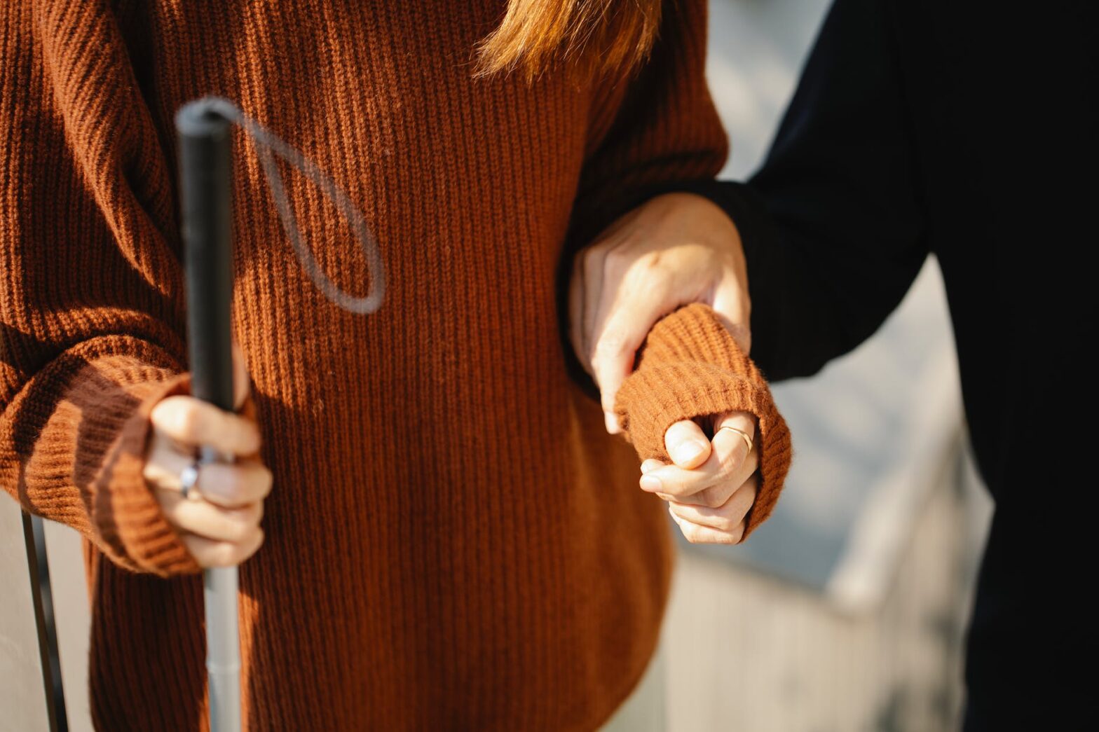 photo of man holding on woman s arm