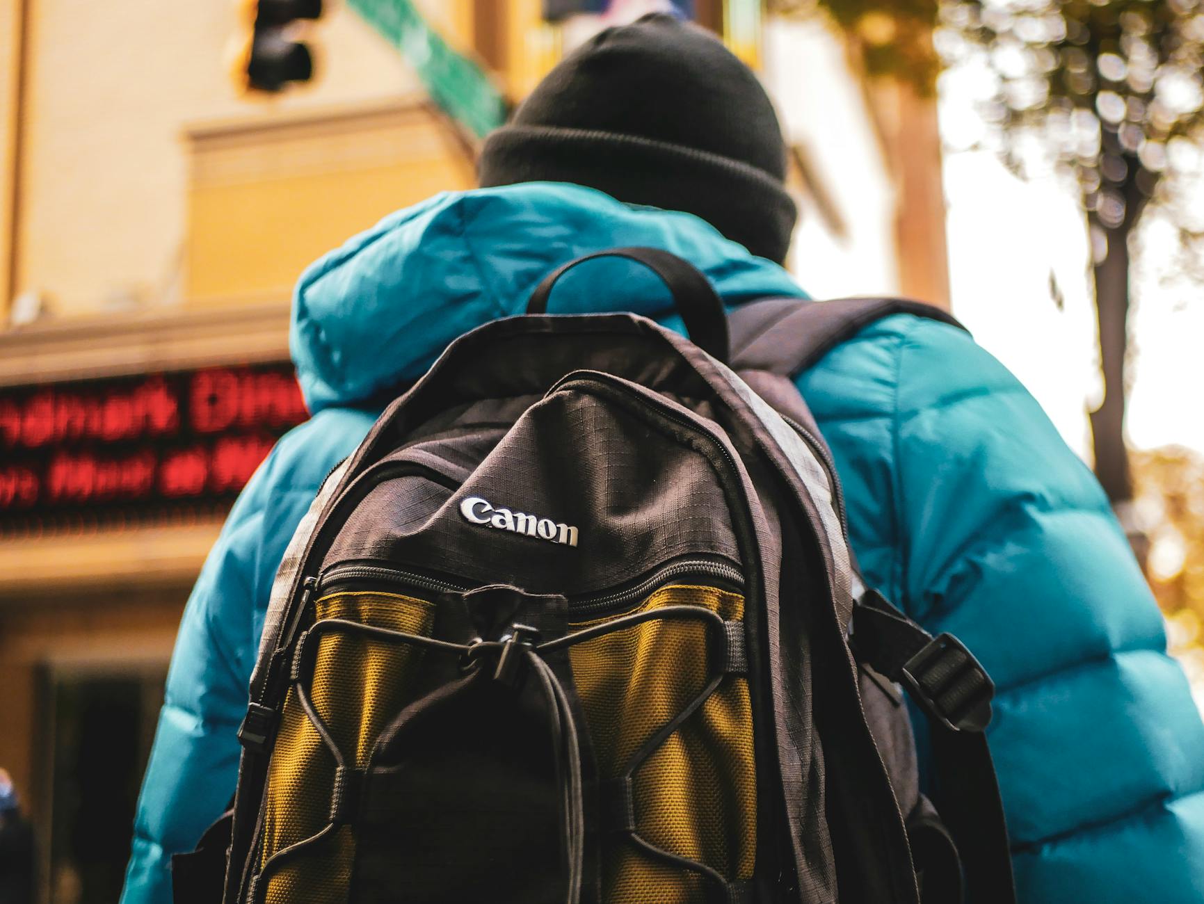 person wearing bonnet and backpack