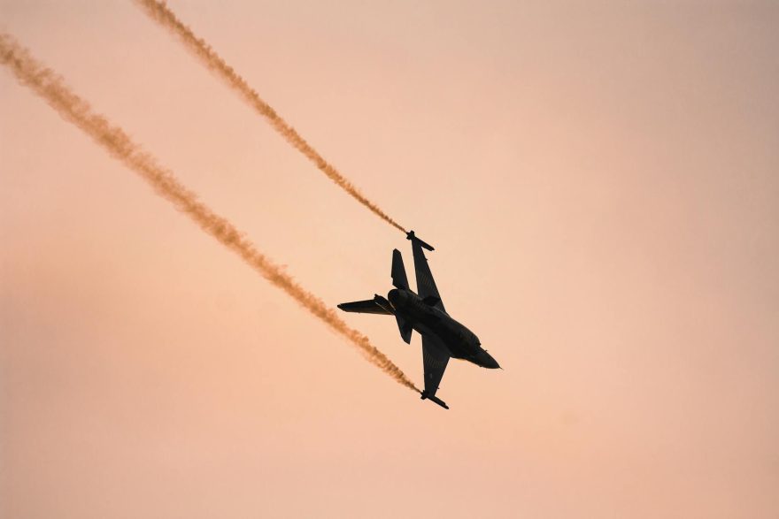 a military airplane at sunset
